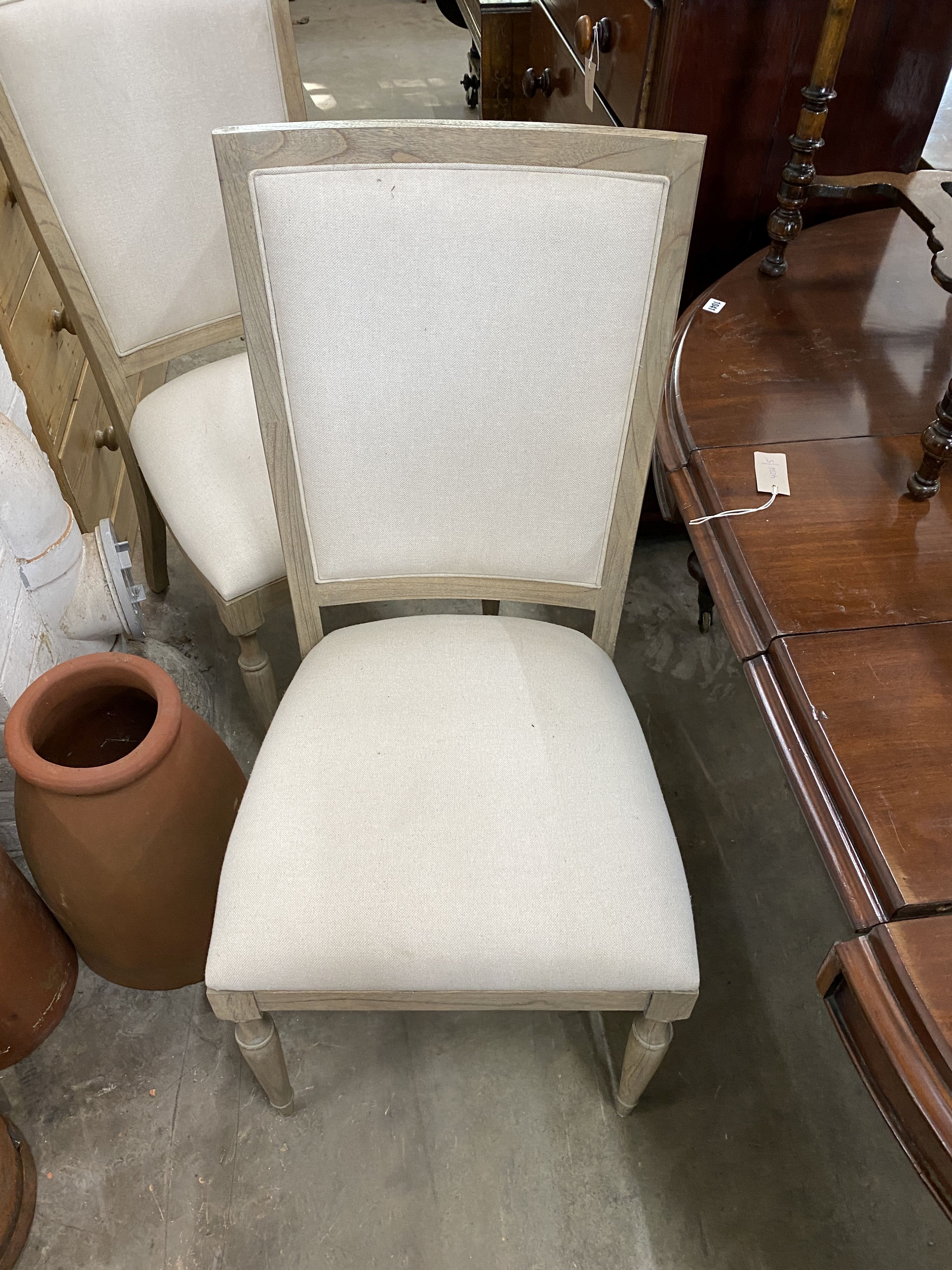 A pair of contemporary bleached oak “Riviera” upholstered high back dining chairs